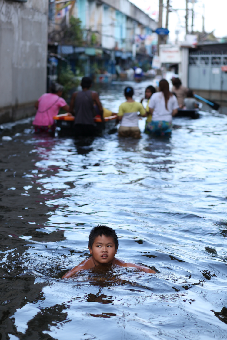 Kid on Flooded Street 